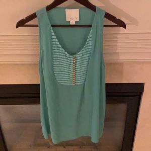 Aryn K. Sleeveless top with front gold buttons